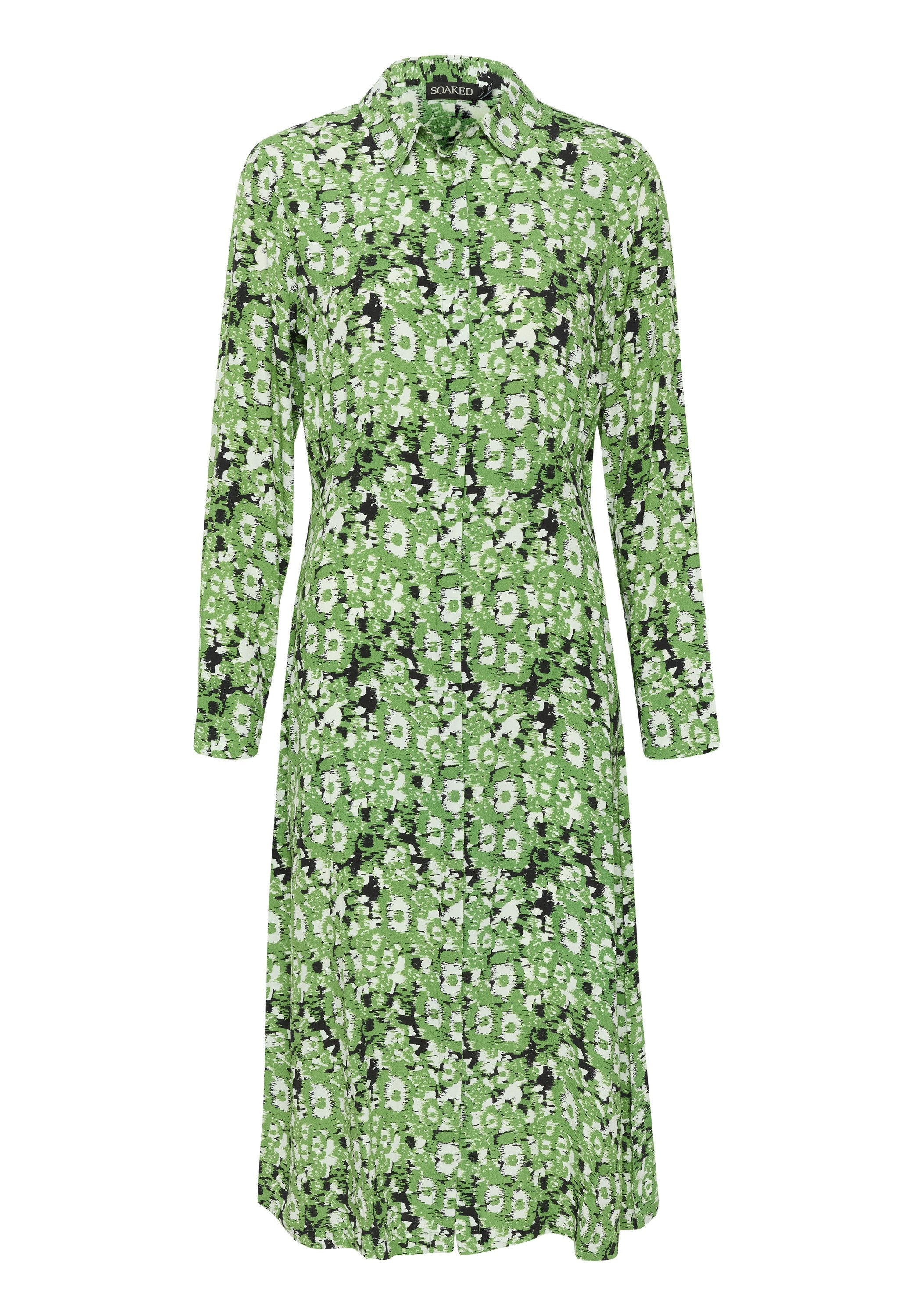 Grünes Blumenkleid mit langen Ärmeln, Knopfleiste, Kragen und einem fließenden Schnitt. Das Muster zeigt weiße Blumen auf einem grünen Hintergrund.