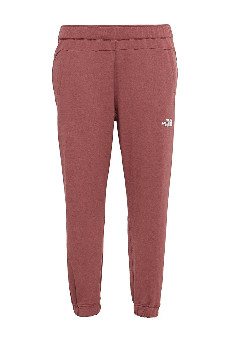 Bordeauxfarbene Jogginghose mit einem elastischen Bund, Seitentaschen und gerippten Bündchen. Enthält ein kleines weißes Logo auf dem linken Oberschenkel. Weicher, leichter Stoff.