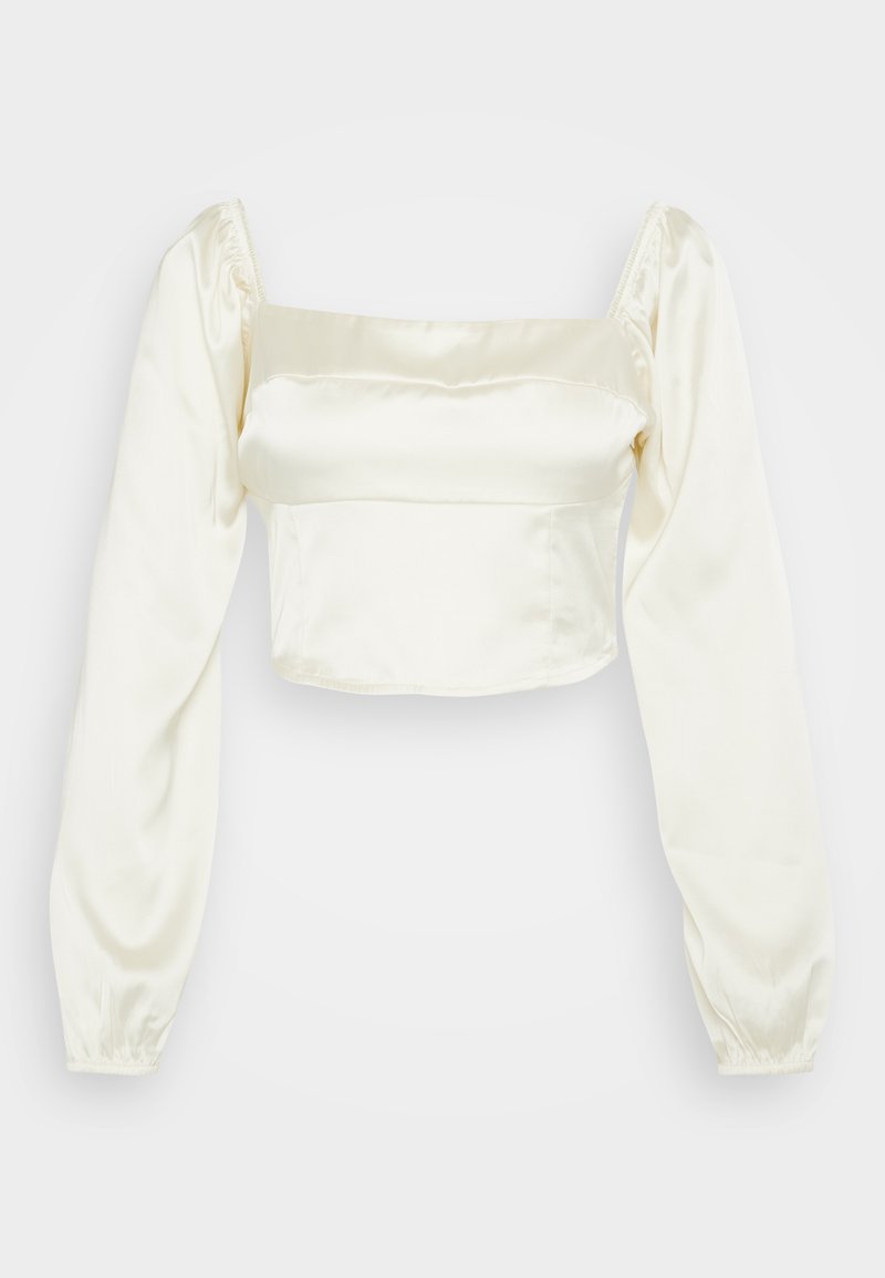 Leicht verkürzte Bluse aus cremigem Satin. Quadratischer Ausschnitt, lange Puffärmel und geraffte Manschetten. Glatte Textur mit eleganter Silhouette.