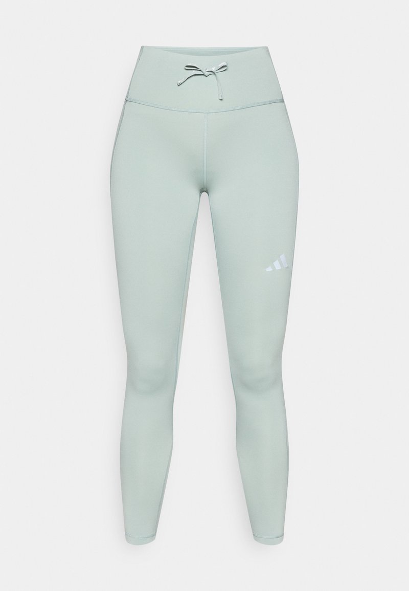 Hellgrüne sportliche Leggings mit hohem Bund, Kordelzug und weißem Logo am linken Oberschenkel. Glatter, dehnbarer Stoff.