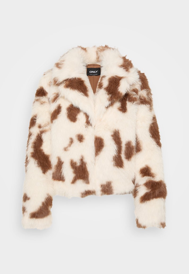 Kunstpelzjacke mit einem Kuhmuster in Weiß und Braun. Sie verfügt über einen Kragen, hat ein verkürztes Design und lange Ärmel. Das Innere ist in Beige.