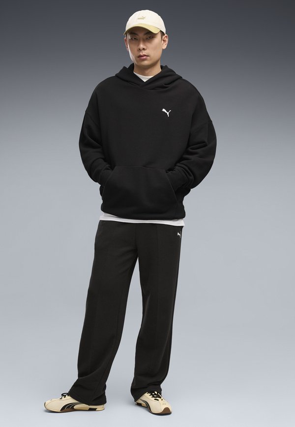 Puma ESSENTIALS RELAXED JOGGINGHOSE - Tracksuit bottoms - black