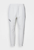 Under Armour UNSTOPPABLE FLEECE - Tracksuit bottoms - summit white/black