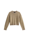Beige gekürzter Pullover mit langen Ärmeln, Rundhalsausschnitt, strukturiertem Stoff und geripptem Saum. Geeignet für Freizeitbekleidung.