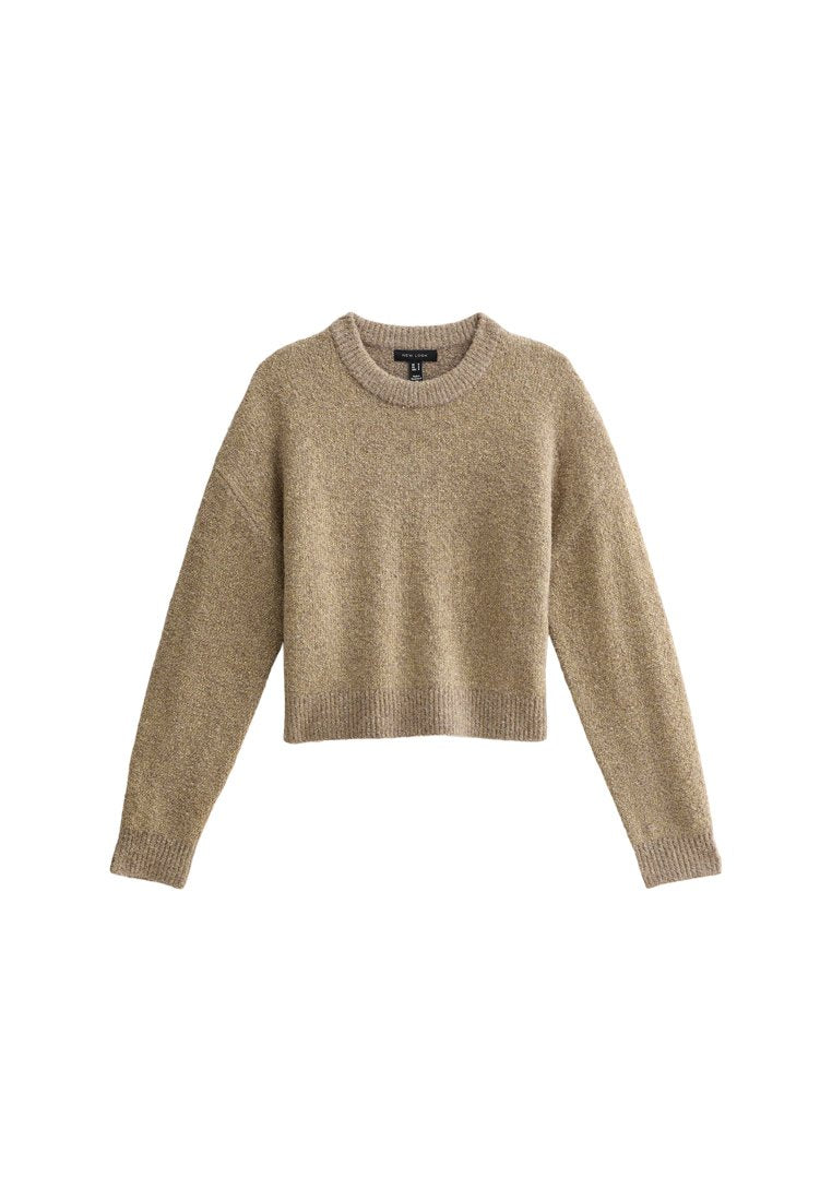 Beige gekürzter Pullover mit langen Ärmeln, Rundhalsausschnitt, strukturiertem Stoff und geripptem Saum. Geeignet für Freizeitbekleidung.
