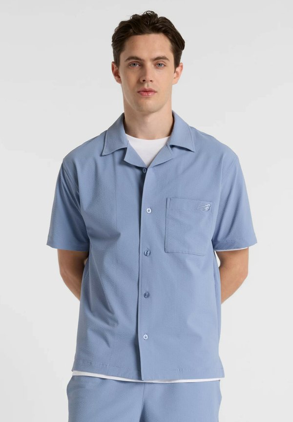 New Balance BUTTON UP SHORT SLEEVE - Shirt - dusk shower