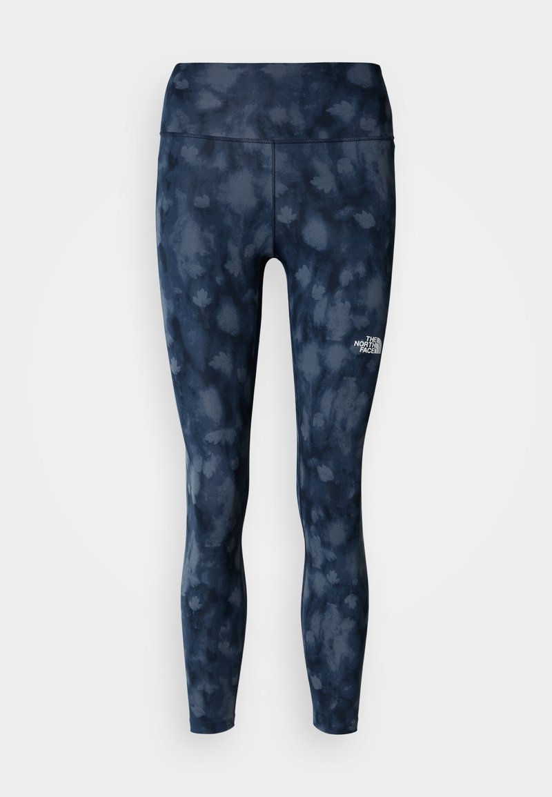 Marineblaue Leggings mit Batikmuster, hohem Bund und weißem Logo am unteren Bein. Hergestellt aus dehnbarem, atmungsaktivem Material.