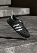 adidas Originals SUPERSTAR LO PRO W - Trainers - core black/footwear white/gold-coloured metallic
