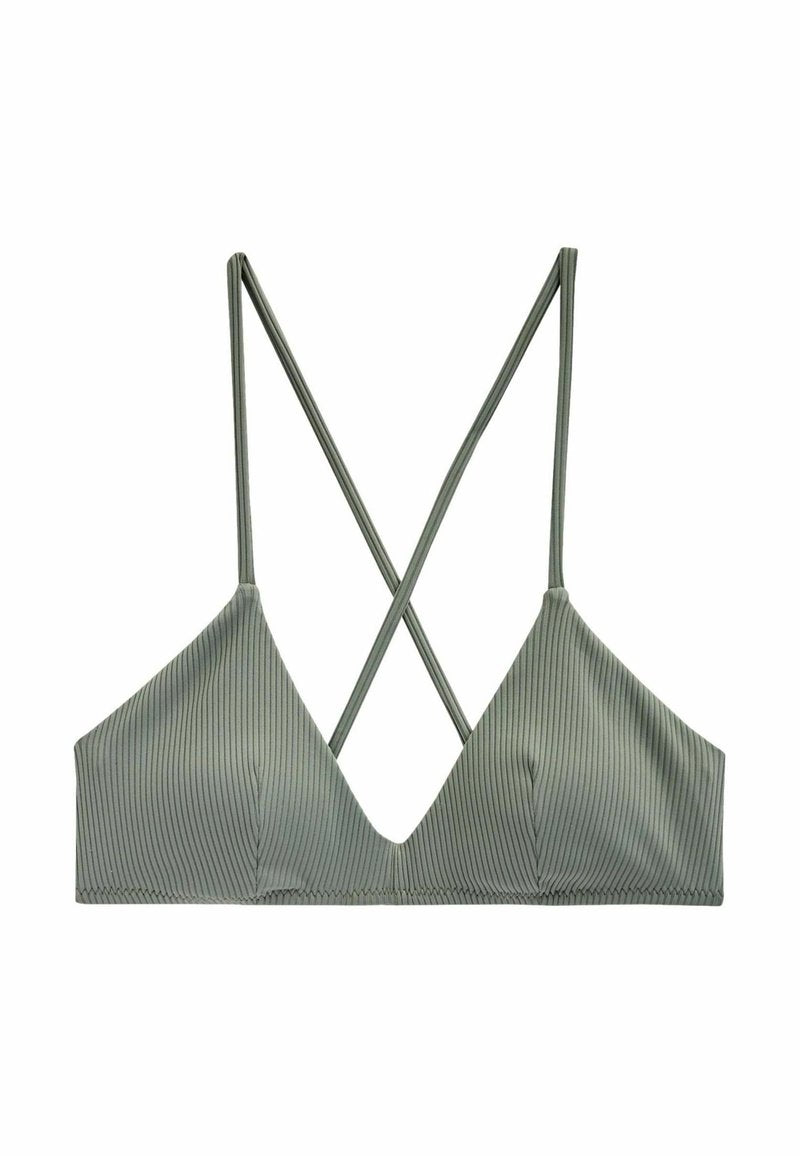 Grüne gerippte Bralette mit tiefem Ausschnitt und überkreuztem Trägerdesign. Weiches, elastisches Gewebe mit glatter Textur.