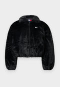 Schwarze kurze Jacke aus weichem Kunstpelz mit Reißverschluss, großem Kragen und elastischem Bund. Verfügt über ein kleines Logo-Patch auf der Brust.
