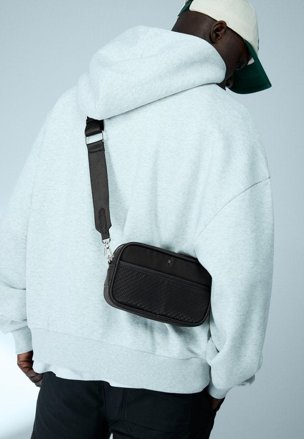 Bershka MONOGRAM TECHNICAL - Cross body bag - black