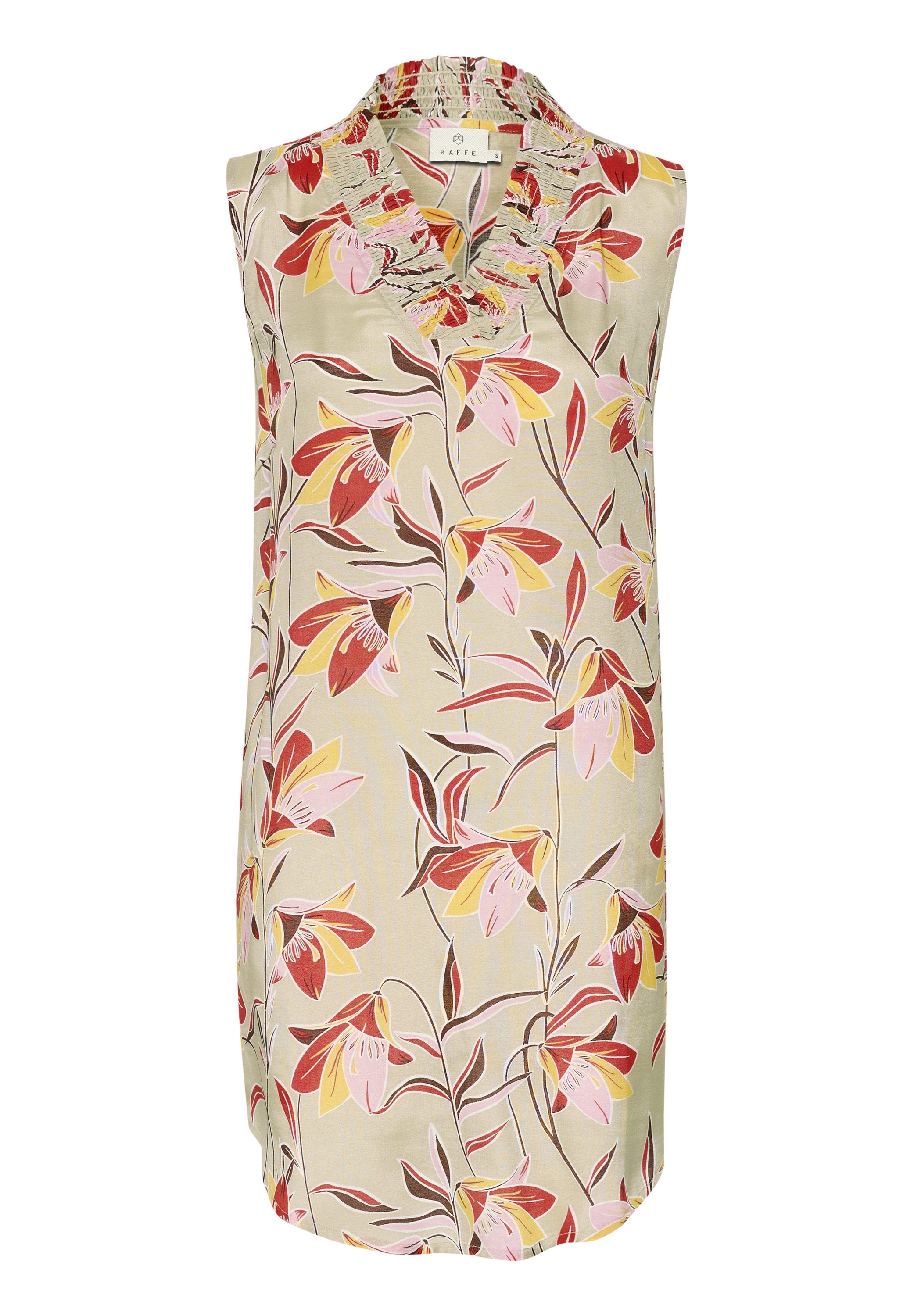Ärmelloses Oberteil mit Blumenmuster in hellbeige, ausgestattet mit einem Rüschenausschnitt und lebhaften pinken, gelben und roten Blüten mit grünen Blättern.