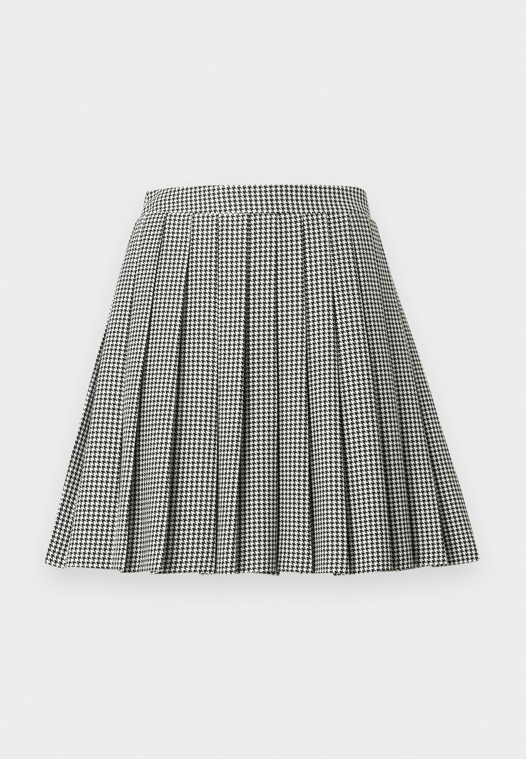 Schwarz-weiß karierter, plissierter Hahnentrittrock mit tailliertem Bund und ausgestellter Silhouette, gefertigt aus leichtem Stoff.