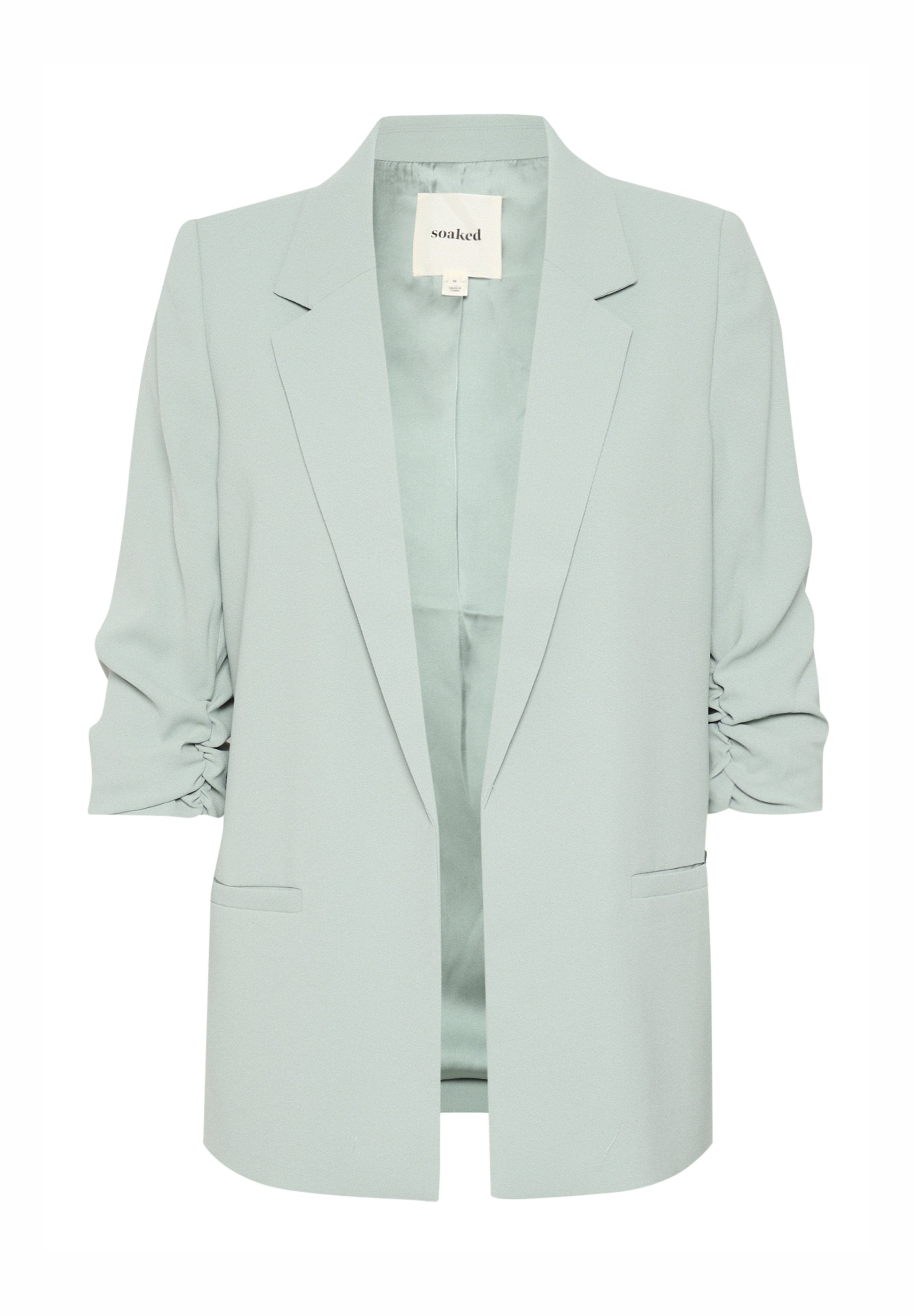 Hellgrüner Blazer mit lockerer Passform, strukturiertem Kragen und gerafften Ärmeln, ausgestattet mit zwei vorderen Taschen und ohne Verschluss. Glatte Stofftextur.