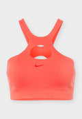 Korallenfarbener Sport-BH mit gekreuzten Schulterträgern und einem zentralen Ausschnitt unterhalb des Ausschnitts, mit kleinem rotem Nike Swoosh-Logo vorne.