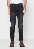 Dunkelblaue Jeans aus Denim mit schmaler Passform, ausgestattet mit einem Knopfverschluss, vorderen Taschen und leichter Ausbleichung. Gestickte Details und dezente Markenkennzeichnung sichtbar.