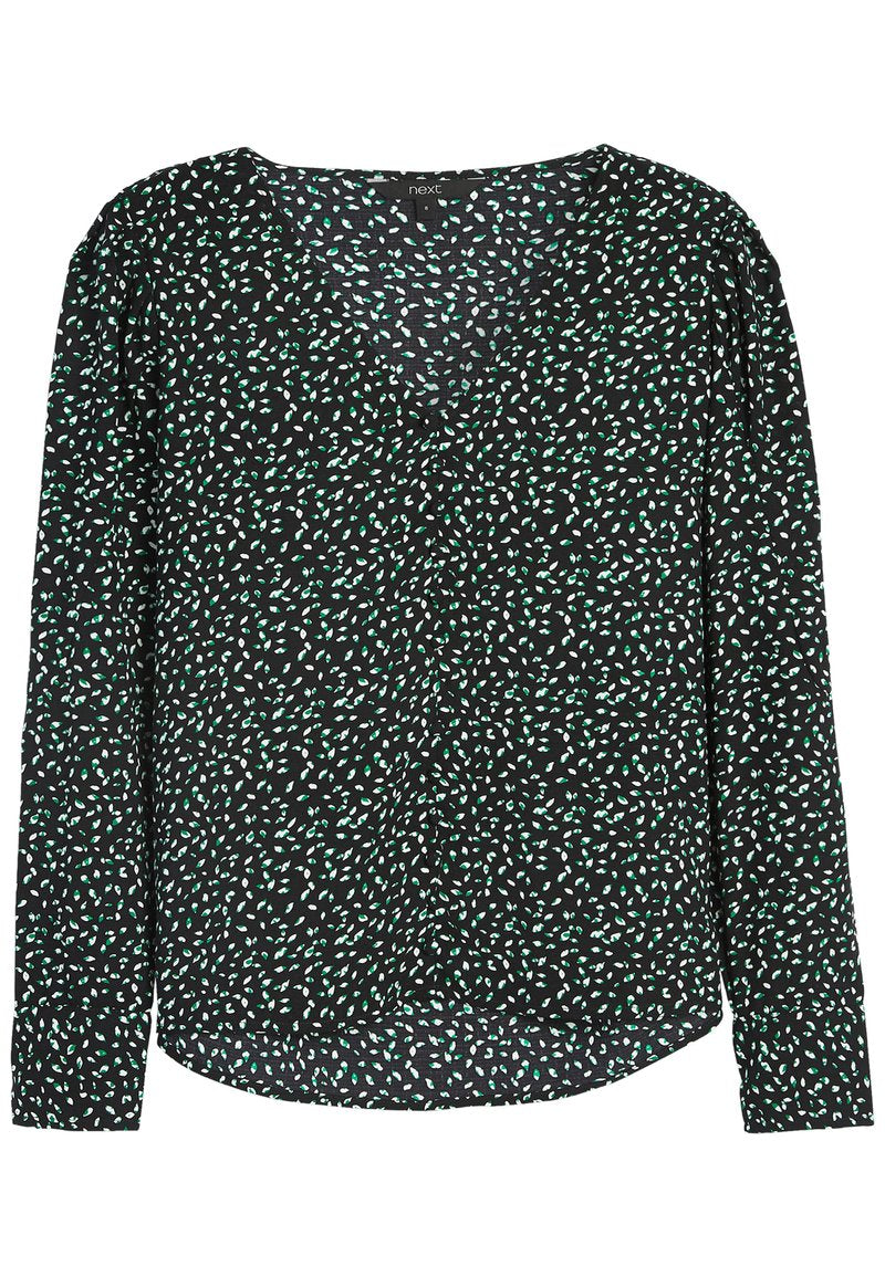 Schwarze Bluse mit langen Ärmeln, V-Ausschnitt, grün-weißer abstrakter Musterung, weichem Stoff und leicht gerafften Schultern.