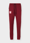 Weinrote Nike-Sweathose mit schwarzem Kordelzug, polnischem Adler-Emblem am linken Oberschenkel und rotem Nike-Swoosh am rechten Oberschenkel, schlanke Passform.