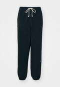 Schwarze Jogginghosen aus weichem Stoff, mit einem elastischen Bund und Kordelzug, eng geschnittenen Knöcheln und einem kleinen weißen Logo-Accente.