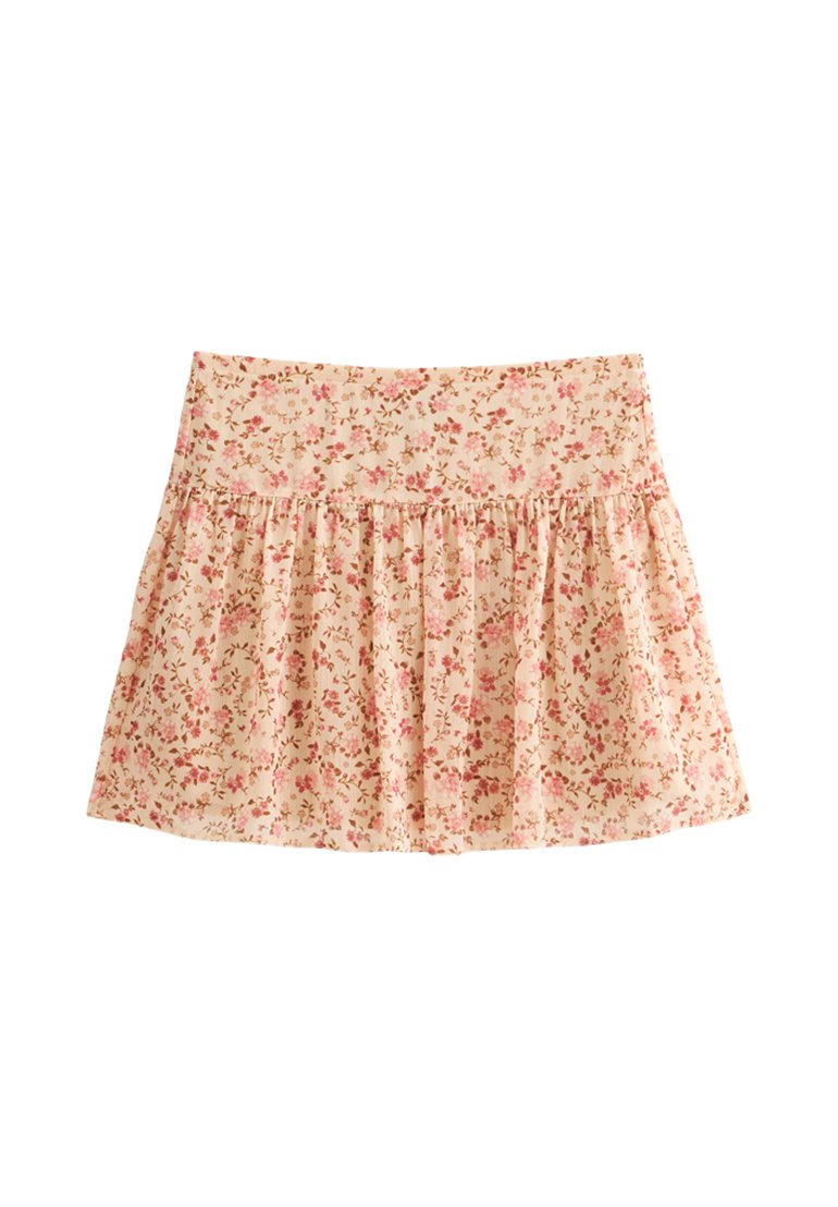 Blumiger Rock mit einem hellen Pfirsich-Hintergrund, der kleine rosa und braune Blumen zeigt. Geraffte Textur und ein Bund oben.