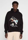 Schwarzer Baumwoll-Hoodie mit einem Grafikdruck eines Adlers auf der Vorderseite, mit dem Text "Cold Hearted" in Weiß und einem kreisförmigen Logo-Design.