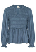 Blaue Bluse mit langen Ärmeln, gerafftem Oberteil, Rüschensaum und einem subtilen Glanz. Sie verfügt über einen Schlüssel-Ausschnitt und einen ausgestellten Saum.