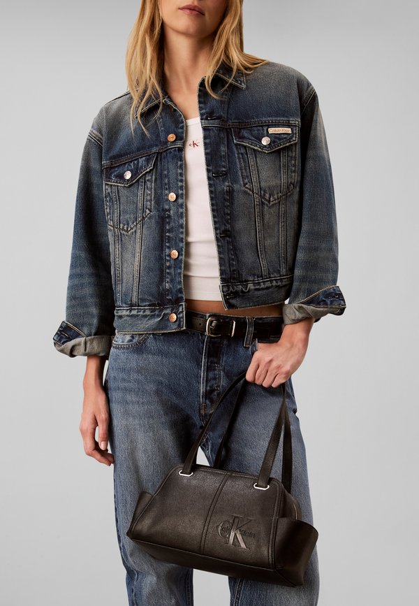 Calvin Klein POCKETS MONOLOGO - Handbag - black