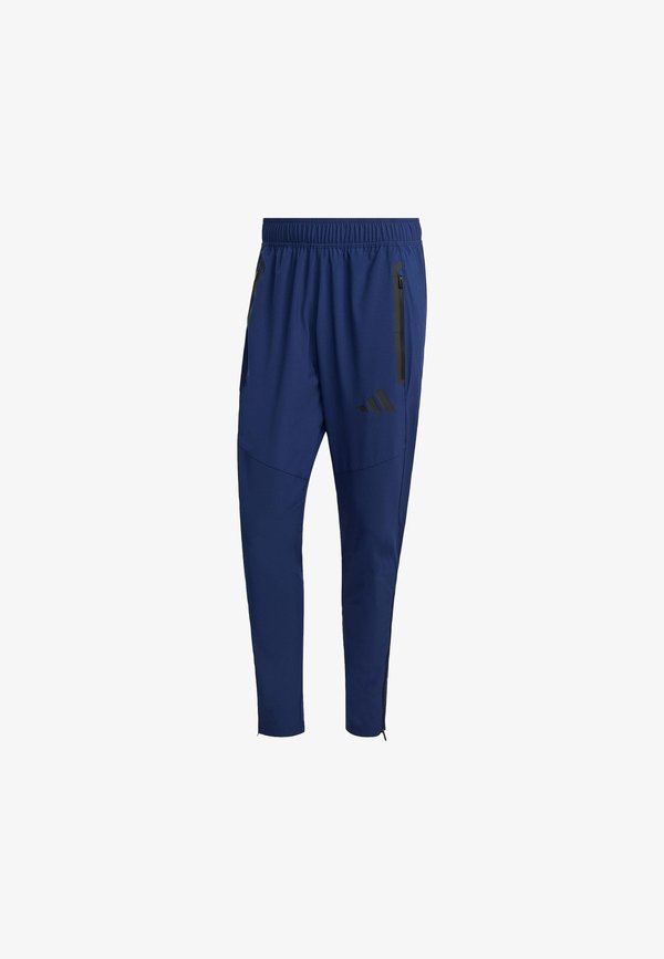 adidas Performance TIRO TRAVEL PANTS - Tracksuit bottoms - team navy blue/black