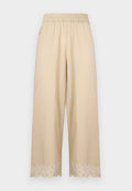 Beige Hose mit weitem Bein, elastischem Bund und besticktem gewelltem Saum.
