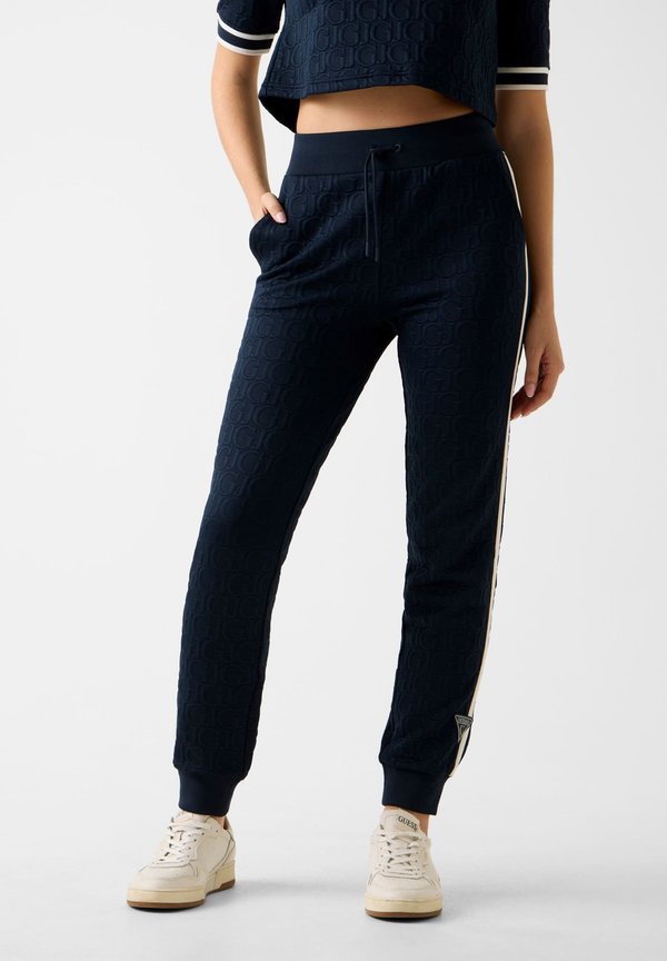 Guess JOGGING -PRÄGELOGO - Tracksuit bottoms - dunkelblau