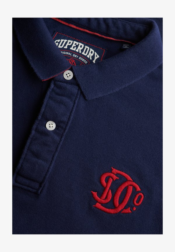 Superdry & Co SUPERDRY PIQUE MONOGRAM POLO SHIRT.. - Polo shirt - darkest navy red