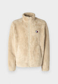 Beige Fleecejacke mit hohem Kragen und durchgehendem Reißverschluss. Verfügt über zwei seitliche Taschen und ein kleines gesticktes Logo auf der Brust. Weicher Stoff.