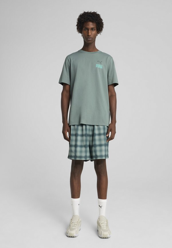 Puma ROAD TO UNITY VALUES GRAPHIC TEE - Print T-shirt - green moon