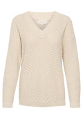 Hellbeige V-Ausschnitt-Strickpullover mit strukturiertem Muster, gerippten Bündchen und Saum. Aus weichem Garn für besonderen Komfort gefertigt.