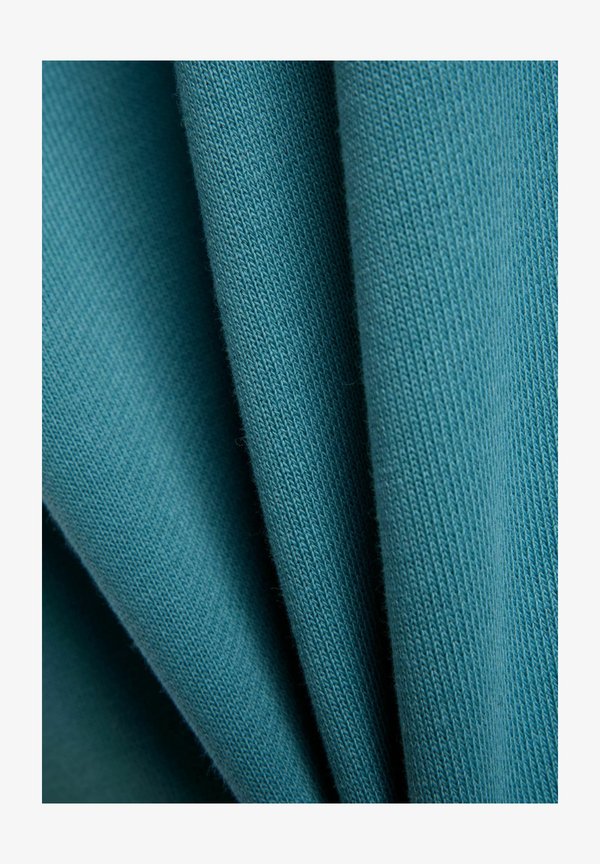New Balance ATHLETICS PREMIUM LOGO RELAXED CROP CREW - Sweatshirt - big teal