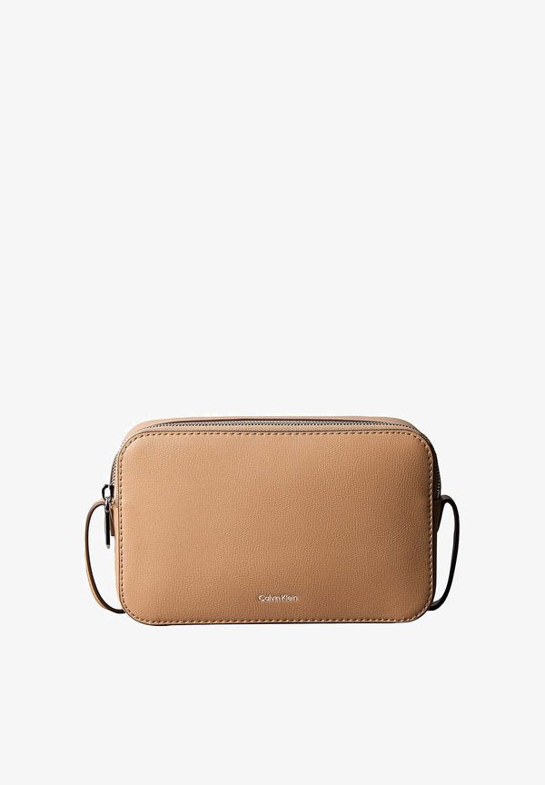Calvin Klein FOIL LOGO ELONGATED CAMERA - Cross body bag - tannin