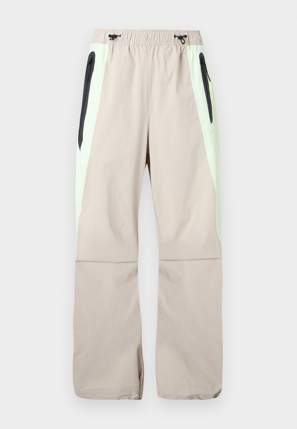 Nike Sportswear Tracksuit bottoms - cream/volt tint/black