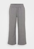 Graue, weit geschnittene Hosen aus einem strukturierten Stoff mit einem elastischen Bund. Sie verfügen über ein dezentes Muster und haben weder Taschen noch Verschlüsse.