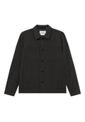 Dunkelgraue Jacke aus strukturiertem Stoff. Mit einem Kragen, durchgehender Knopfleiste, zwei Brusttaschen und seitlichen Eingrifftaschen.