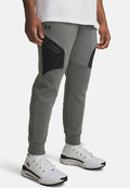 Under Armour UNSTOPPABLE FLEECE - Tracksuit bottoms - clay green