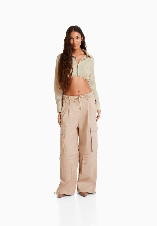 Bershka LONG SLEEVE AND GATHERED DETAIL AT THE FRONT WITH STOPPER