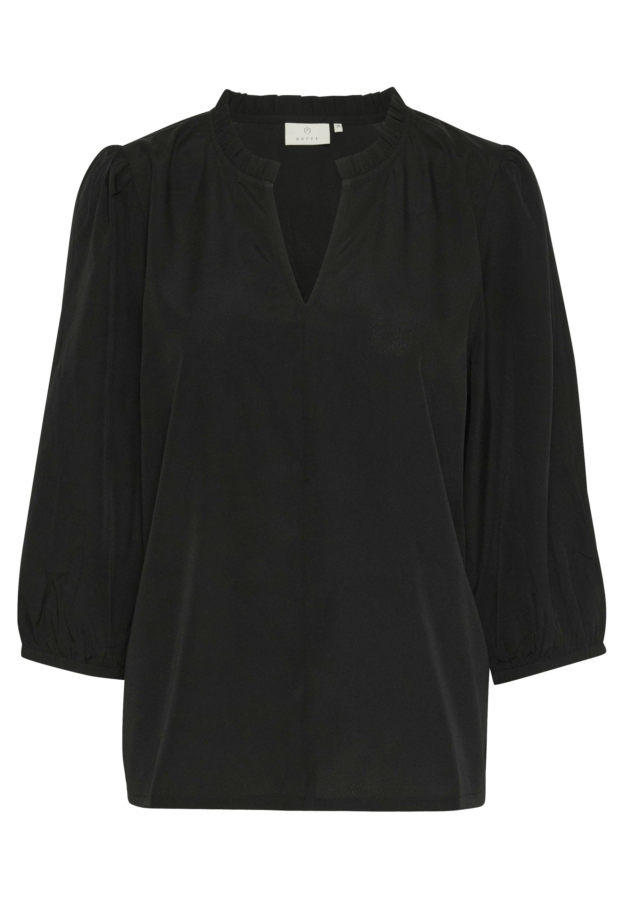 Schwarze Bluse mit V-Ausschnitt, gepufften Schulternähten und Dreiviertel-Puffärmeln. Glatter Stoff mit einem leichten Glanz.