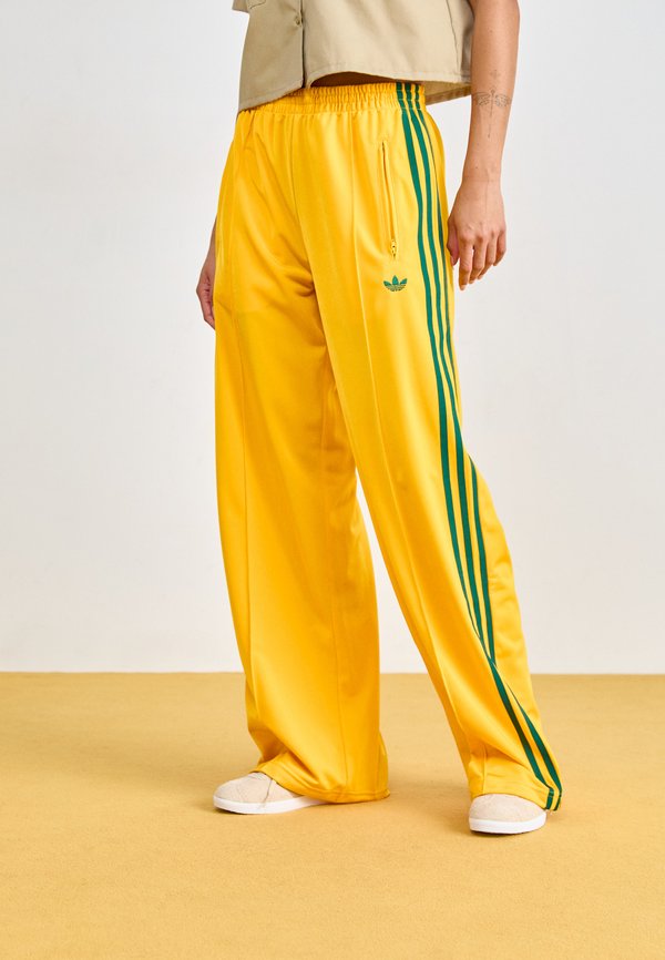 adidas Originals FIREBIRD - Tracksuit bottoms - crew yellow/collegiate green
