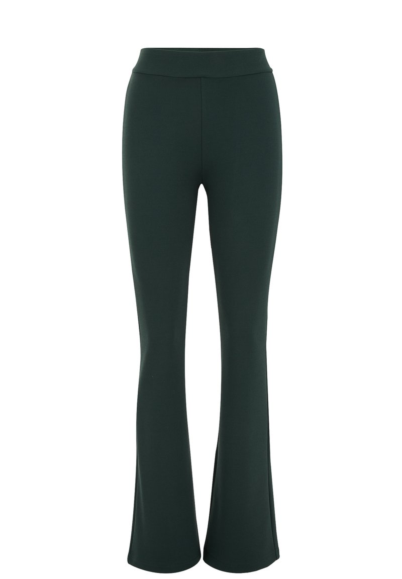 Hüftbetonte Leggings in Dunkelgrün aus elastischem Stoff. Hoher Bund, glatte Textur, schmaler Schnitt, der an den Knöcheln weit ausläuft.