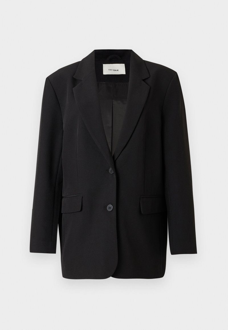 Schwarzer Blazer mit strukturiertem Design, Einzelknopfverschluss, zwei vorderen Taschen und glattem Innenfutter. Taillierte Passform mit Reverskragen.