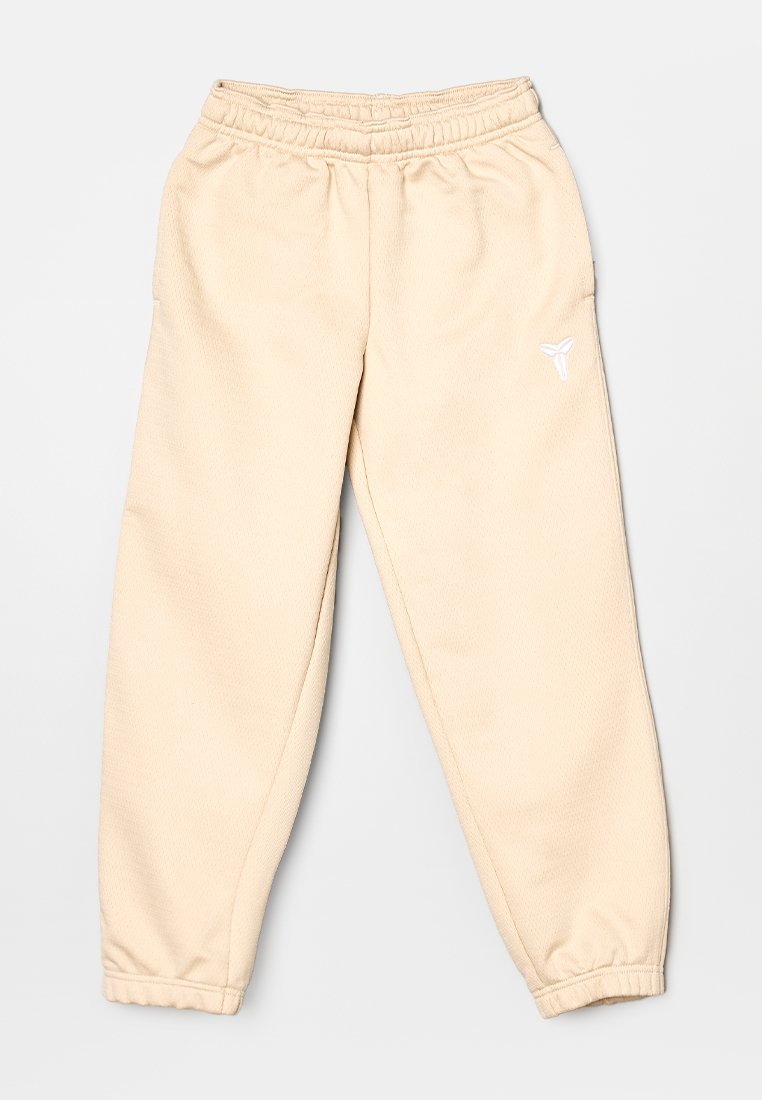 Beige Fleece-Jogginghose mit elastischem Bund, schmal zulaufenden Bündchen und kleinem weißem Logo auf der Vorderseite. Glatte Textur und lässige Passform.