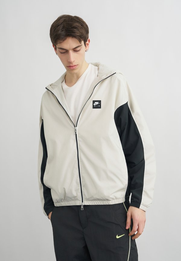 Nike Sportswear HYBRID - Light jacket - light bone/black/white