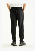 New Balance UTILITY STRETCH WOVEN PANT - Tracksuit bottoms - sport green black