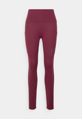 Burgunderfarbene Leggings mit geripptem Muster, hohem Bund und seitlichem Akzent; aus einem flexiblen, dehnbaren Stoff gefertigt.