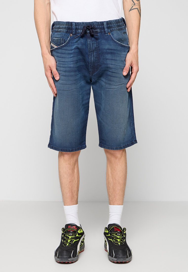 Dunkelblaue Jeansshorts mit elastischem Bund und Kordelzug, im fünf Taschen-Design und mit gestickten Details.
